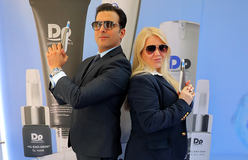 Dr Bilal Malik showcasing Dermapen device at DermapenWorld booth AMWC Monaco