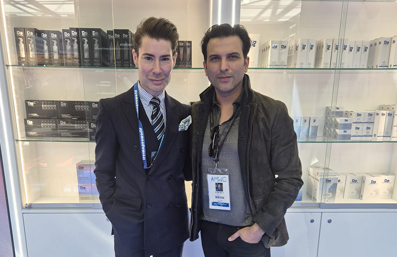 Dr Bilal Malik with aesthetic professional at DermapenWorld booth AMWC Monaco